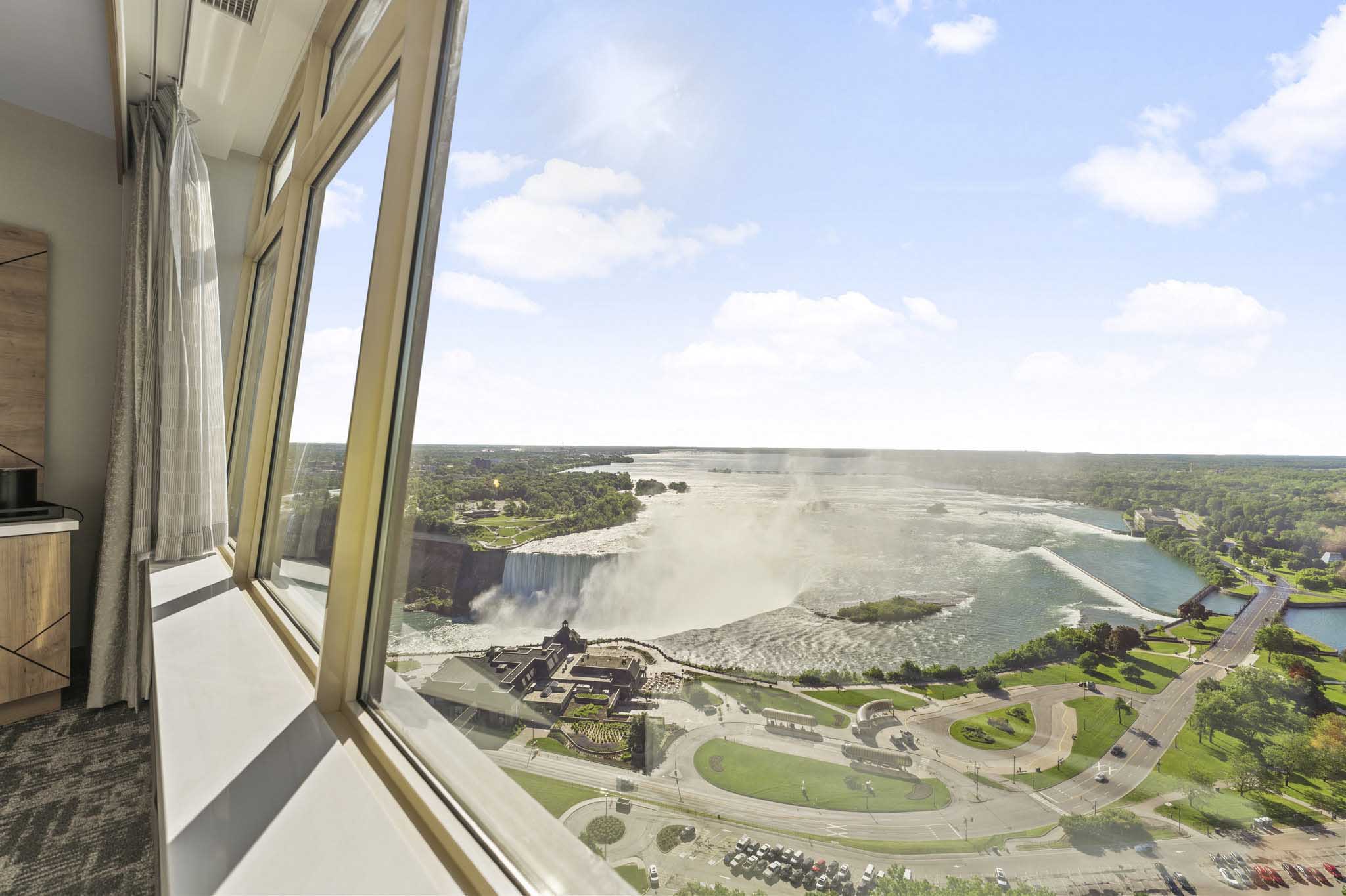 Expansive window offering scenic views of Niagara Falls